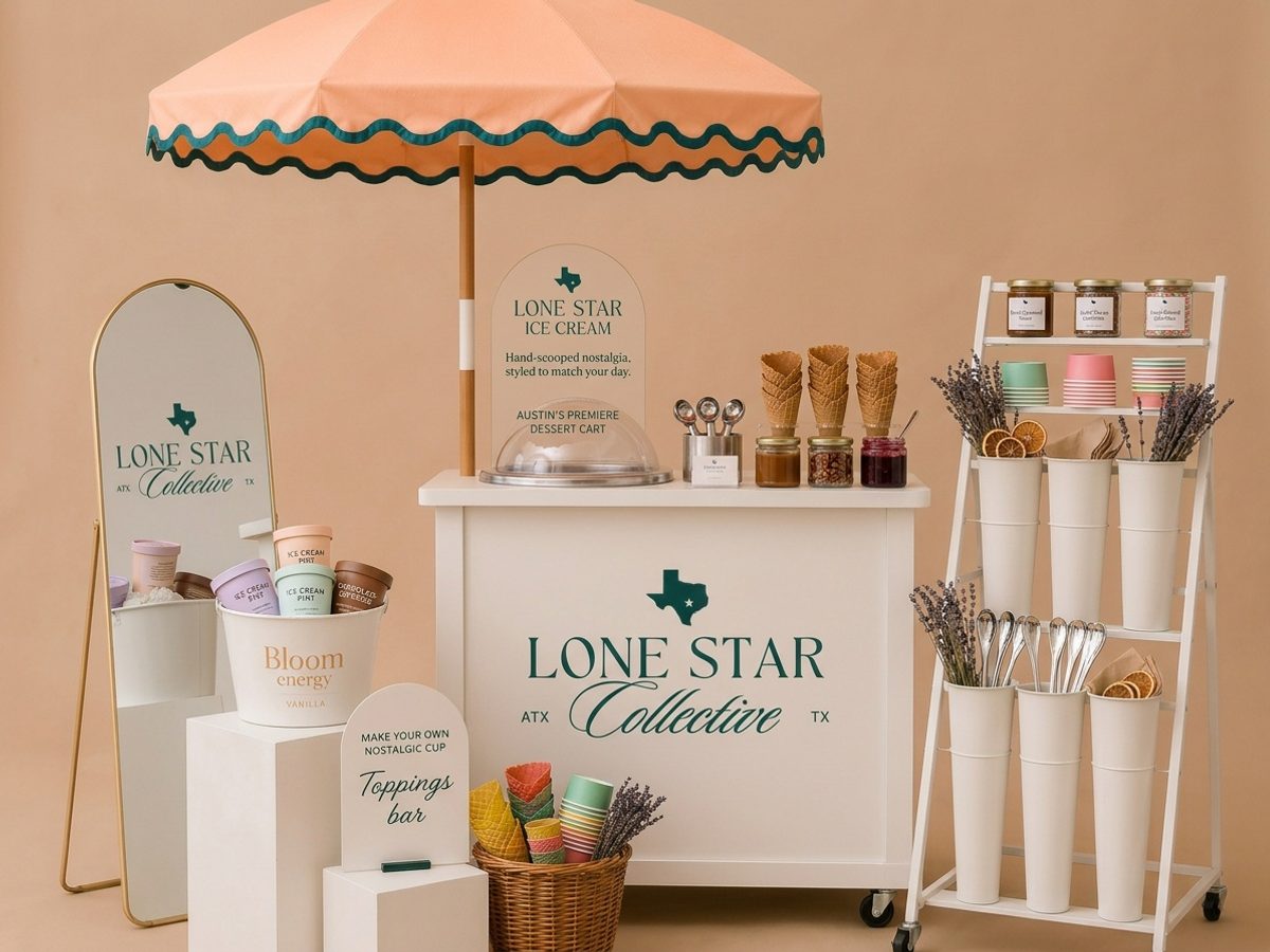 Styled cream event cart with a peach umbrella set up at an Austin event
