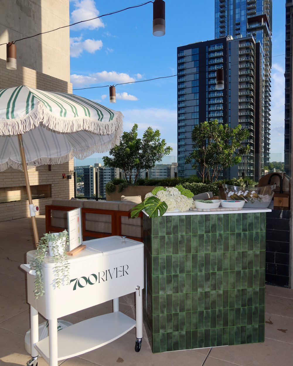 700 River branded popsicle cart on a rooftop terrace in Austin