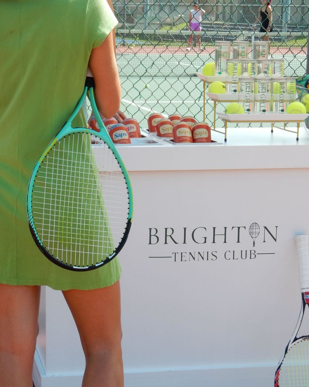 Brighton Tennis Club branded cart on court in Austin