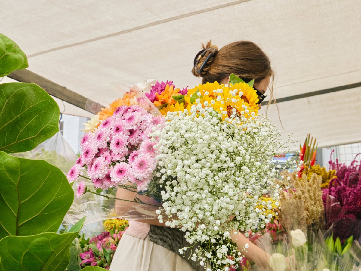 Styled Bloom Bar flower cart with buckets of seasonal blooms at an Austin event